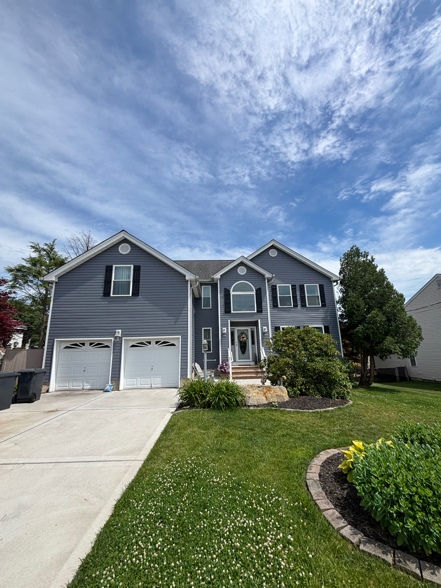 Same gray shore home after Roddy Roofing siding replacement